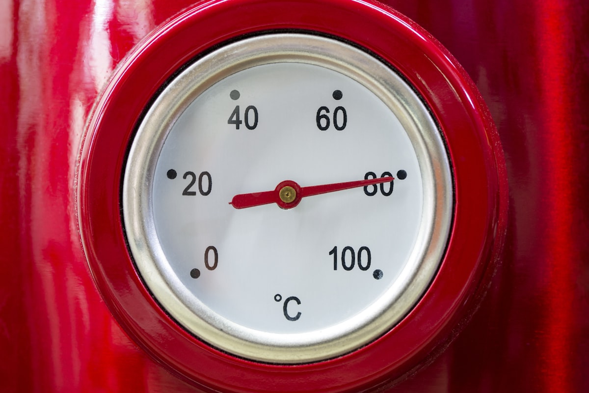 a close up of a thermometer on a red object